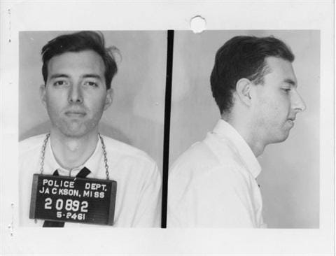 A mug shot of a person

AI-generated content may be incorrect.