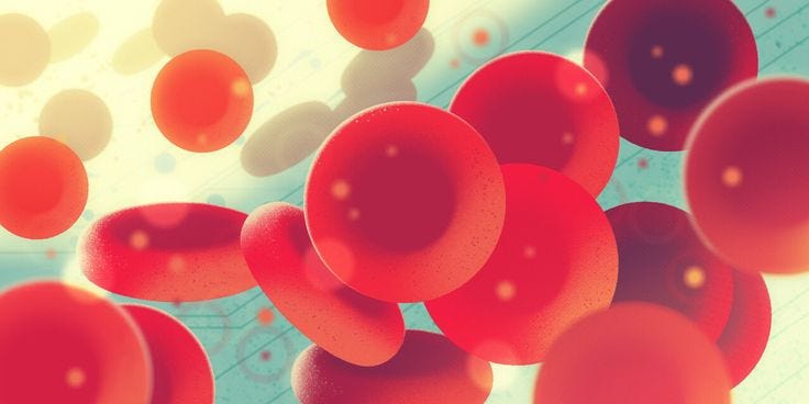 This may contain: some red and white balls are floating in the air