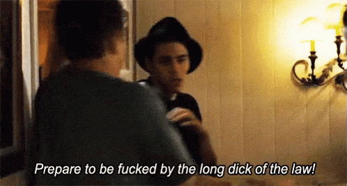 a man in a hat says " prepare to be fucked by the long dick of the law ! "