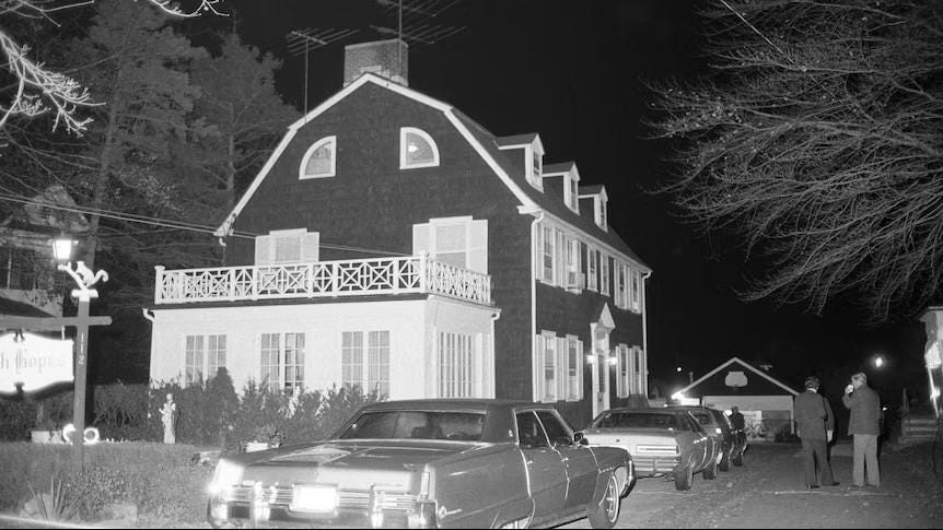 A chilling photo of 112 Ocean Avenue, Amityville, NY, taken the night of the Ronald DeFeo Jr. murders, November 13, 1974, before the infamous Lutz family moved in.