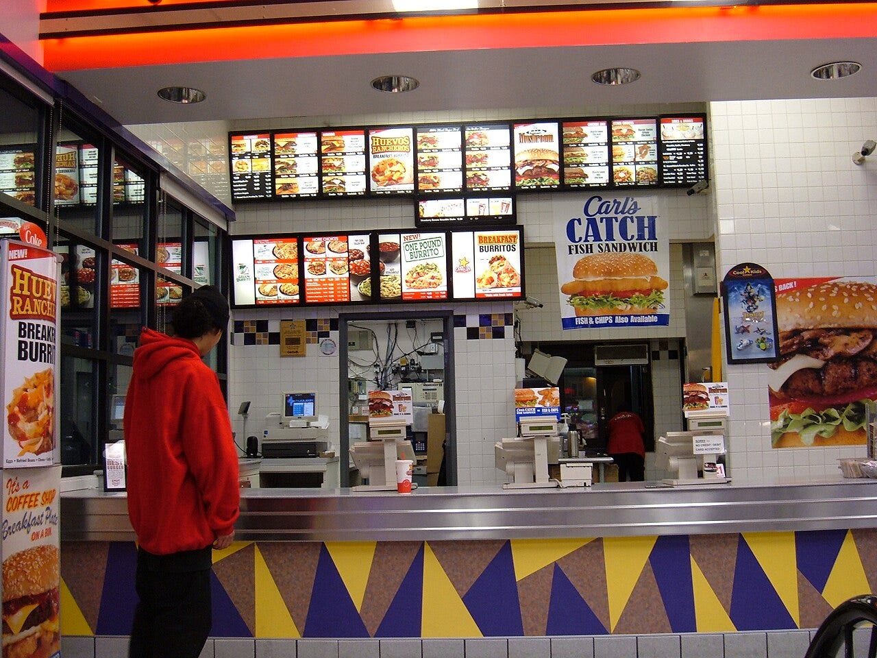 Photo: BrokenSphere / Wikimedia Commons (CC BY-SA 3.0) A service counter at a Chevron gas station in South San Francisco, California serving both Carl's Jr. and Green Burrito products.