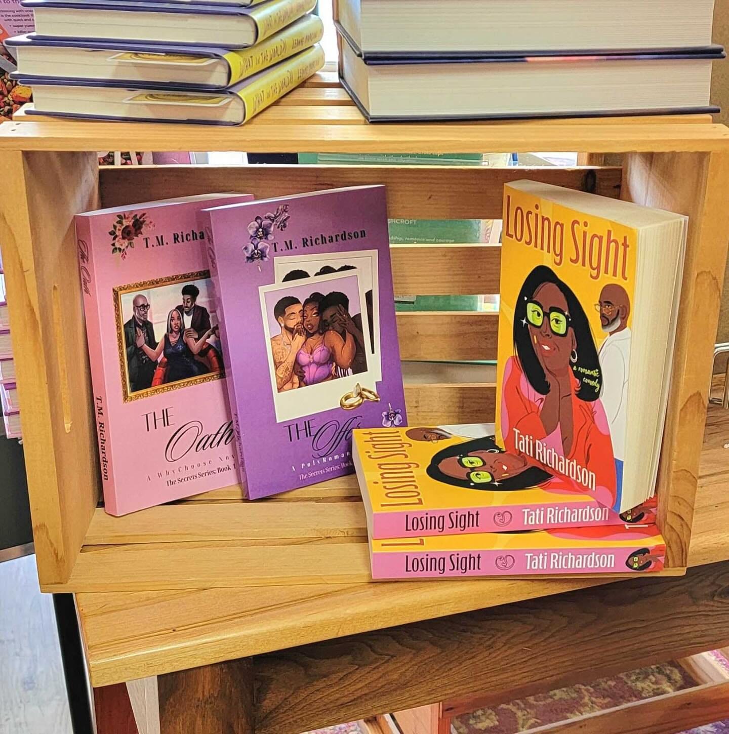May be an image of 4 people, book, shelf and text