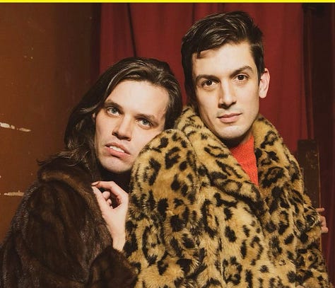 Aaron Jackson and Josh Sharp, both in faux fur coats, Josh's is leopard. Busy on the set of Busy Tonight in cat ears and a leopard dress. Caissie waiting for the train in a Leopard faux fur.