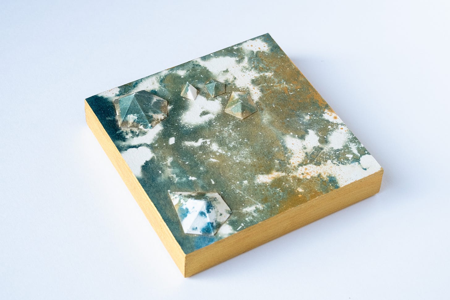 This one is interesting; I used sand instead of weeds, so the pattern is gritty and textural. The tone is almost green-turquoise.