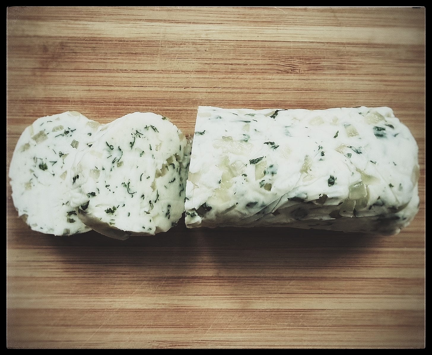 Tarragon and shallot compound butter rolled into a log, chilled, and then sliced. Tarragon and shallot compound butter rolled into a log, chilled, and then sliced.