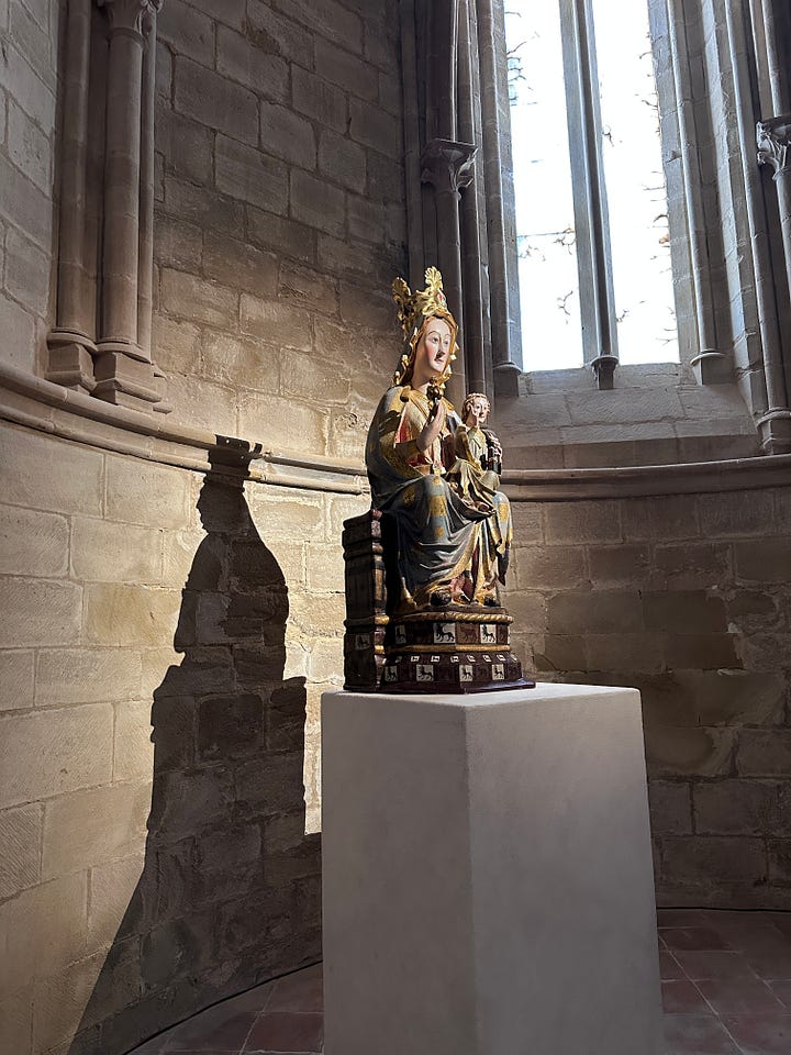 Inside the chapel at the Monasterio de Santa María, Renaissance altarpiece, 15th century Madonna and Child statue, and the tomb of Doña Urraca López de Haro.