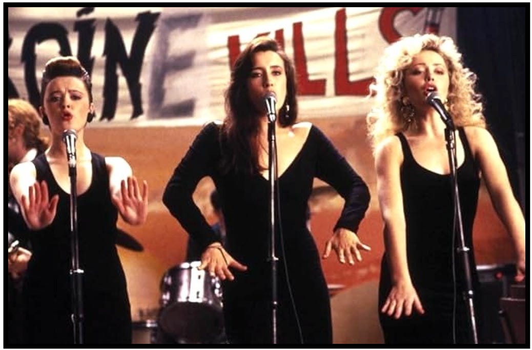 Bernie, Natalie, and Imelda perform onstage in a scene from the movie, "The Commitments."