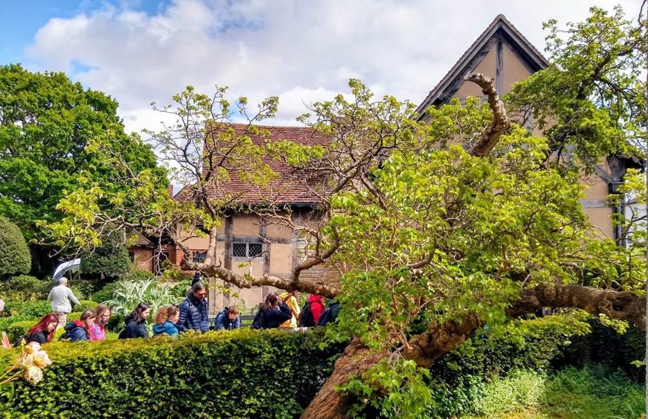 A group of people standing in front of a house
AI-generated content may be incorrect. A group of people standing in front of a house
AI-generated content may be incorrect.