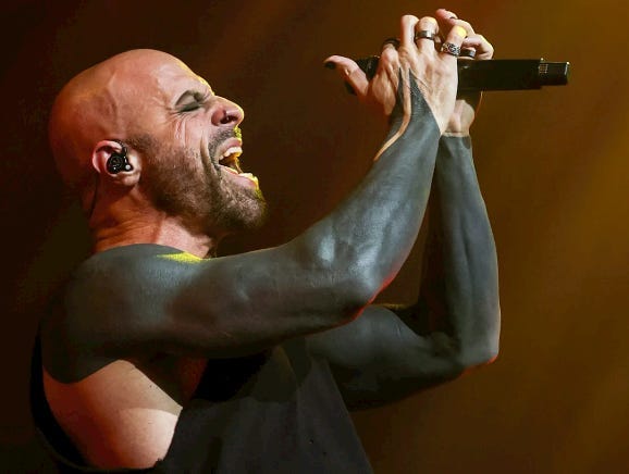 A person singing into a microphone
AI-generated content may be incorrect. A person singing into a microphone
AI-generated content may be incorrect.
