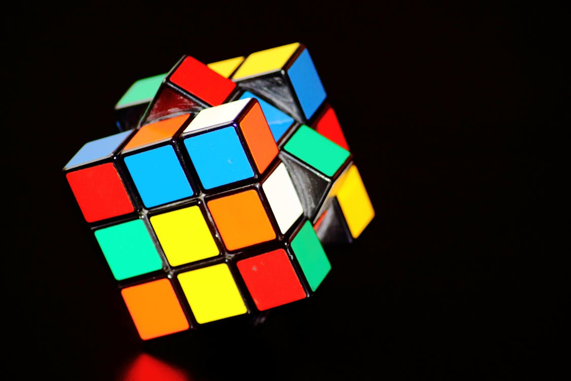 Free A close-up of a colorful Rubik's Cube puzzle, showcasing concentration and play. Stock Photo Free A close-up of a colorful Rubik's Cube puzzle, showcasing concentration and play. Stock Photo