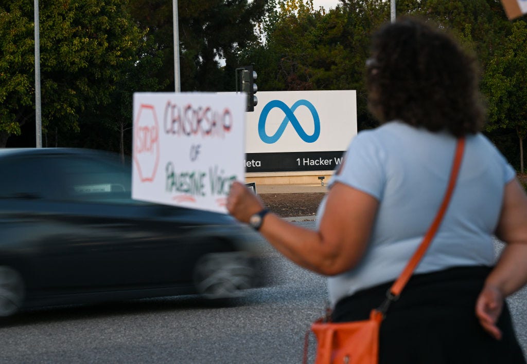 Someone outside of Meta Headquarters to protest on censoring Palestine