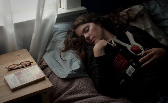 Reading this Week 2-20-11 Girl on bed with book