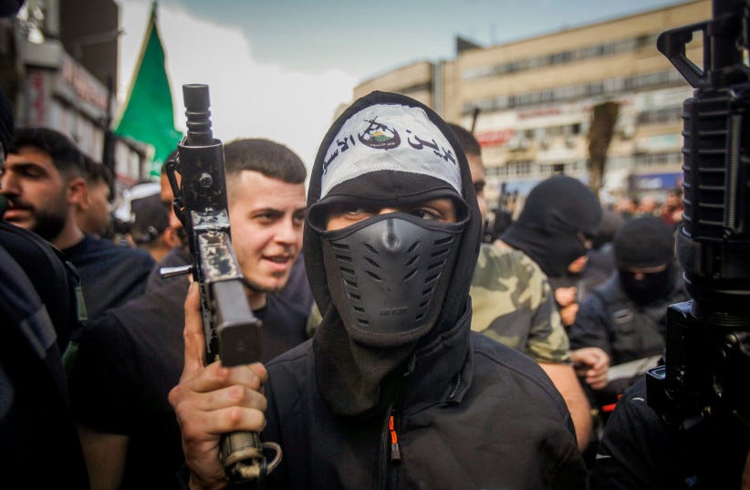 Palestinian gunmen and mourners attend the funeral of five Palestinians who were killed by the Israeli army during a military operation, in the West Bank city of Nablus, October 25, 2022. (photo credit: NASSER ISHTAYEH/FLASH90) Palestinian gunmen and mourners attend the funeral of five Palestinians who were killed by the Israeli army during a military operation, in the West Bank city of Nablus, October 25, 2022. (photo credit: NASSER ISHTAYEH/FLASH90)