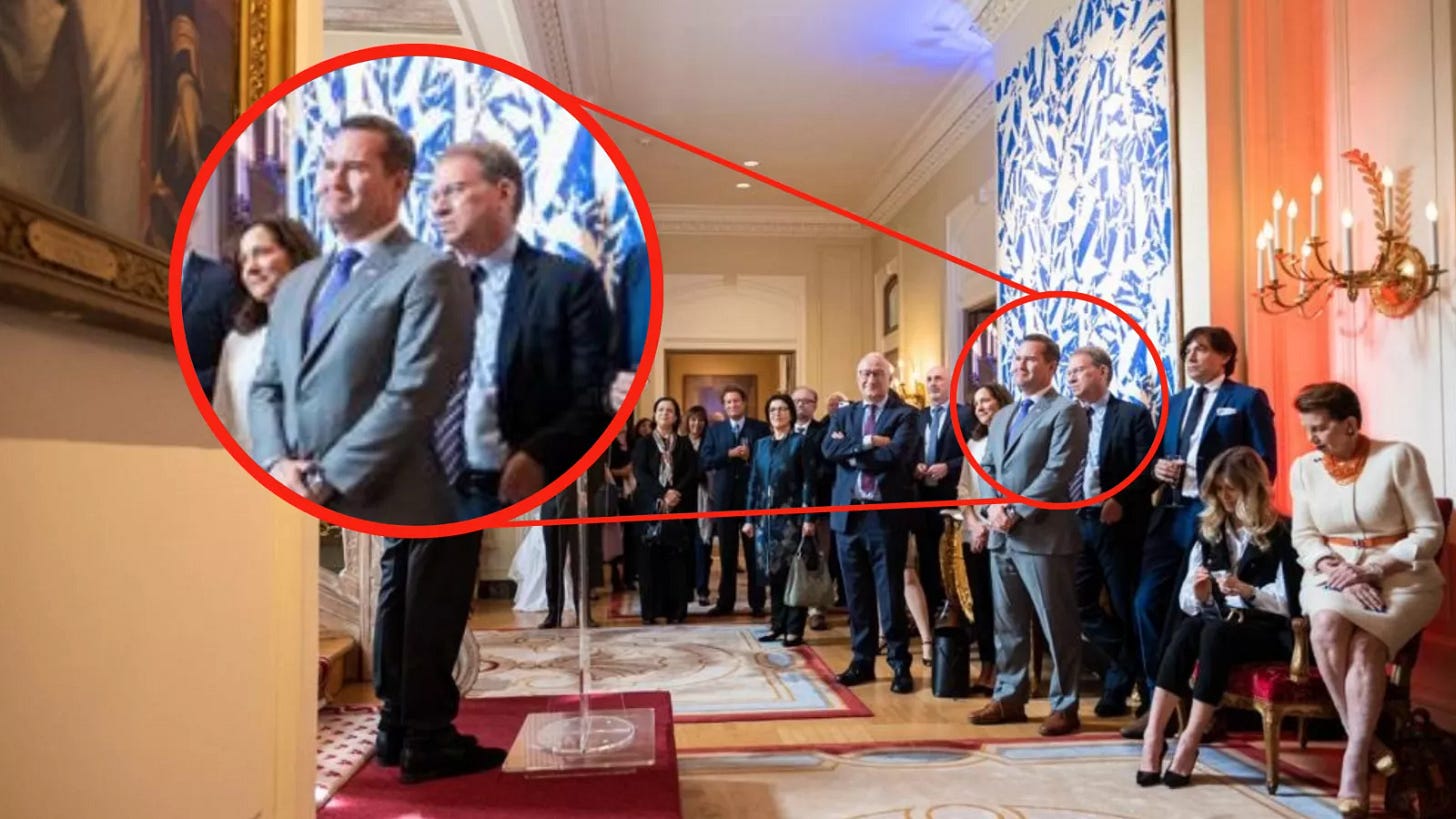 Waltz and Goldberg standing next to each other at small event in French embassy