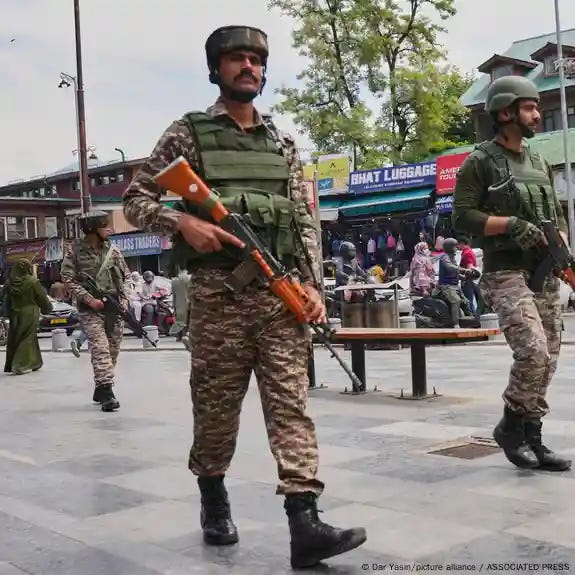Indian paramilitary soldiers patrol a busy market in Srinagar, in India-controlled Kashmir. Indian paramilitary soldiers patrol a busy market in Srinagar, in India-controlled Kashmir.