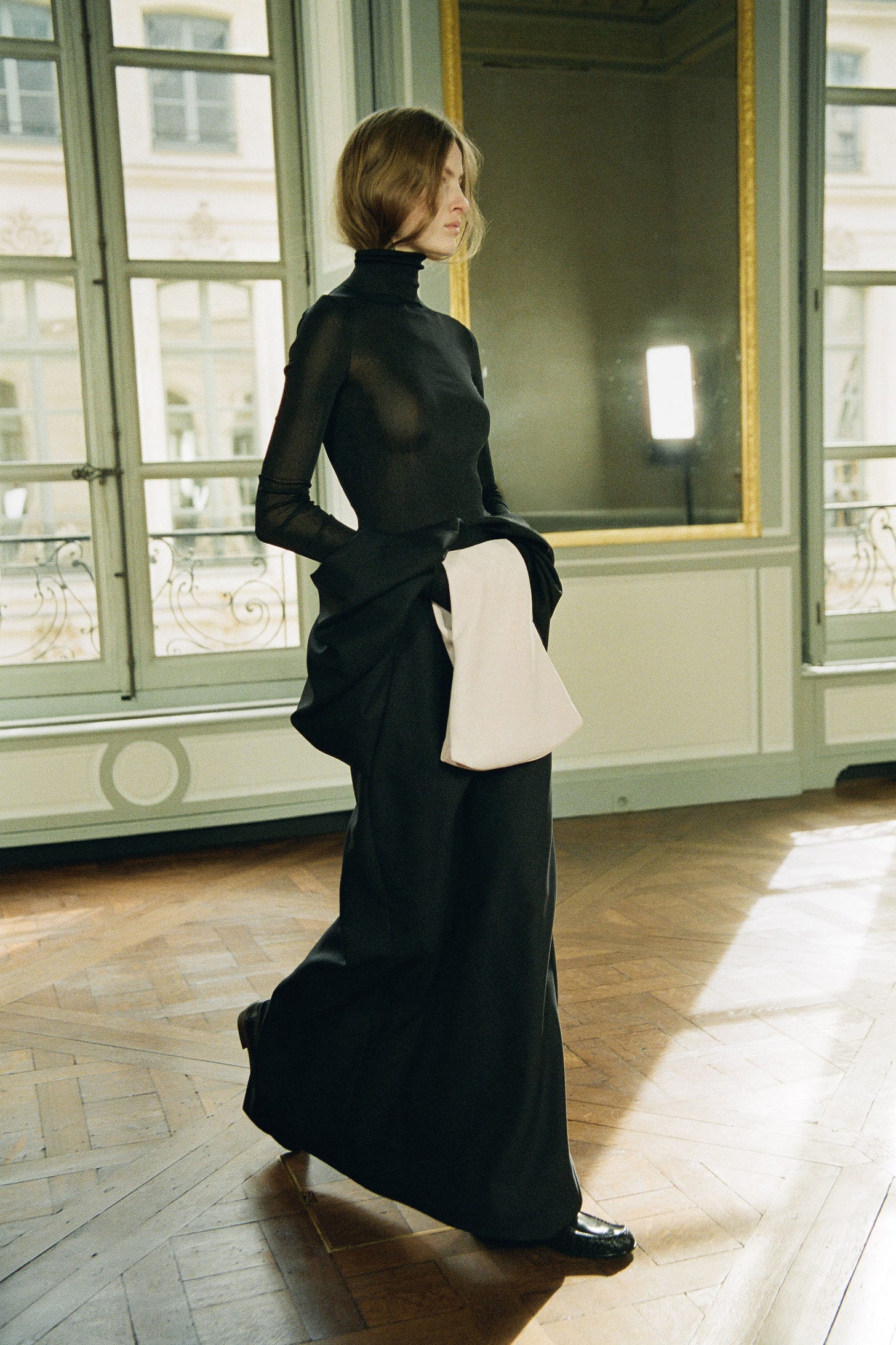 Image may contain Coat Clothing Apparel Dress Sleeve Human Person Evening Dress Fashion Gown Robe and Long Sleeve