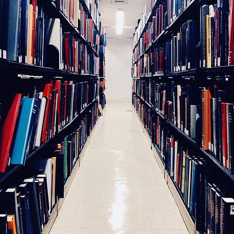 Three photos of library shelves full of books.