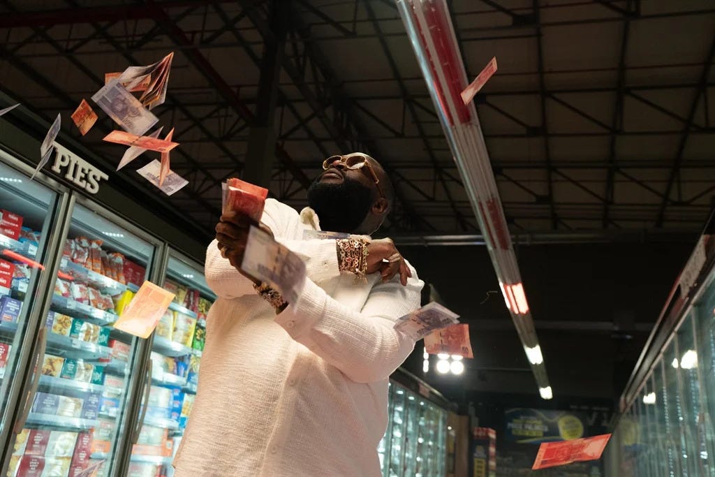 Rick Ross throwing money in the air