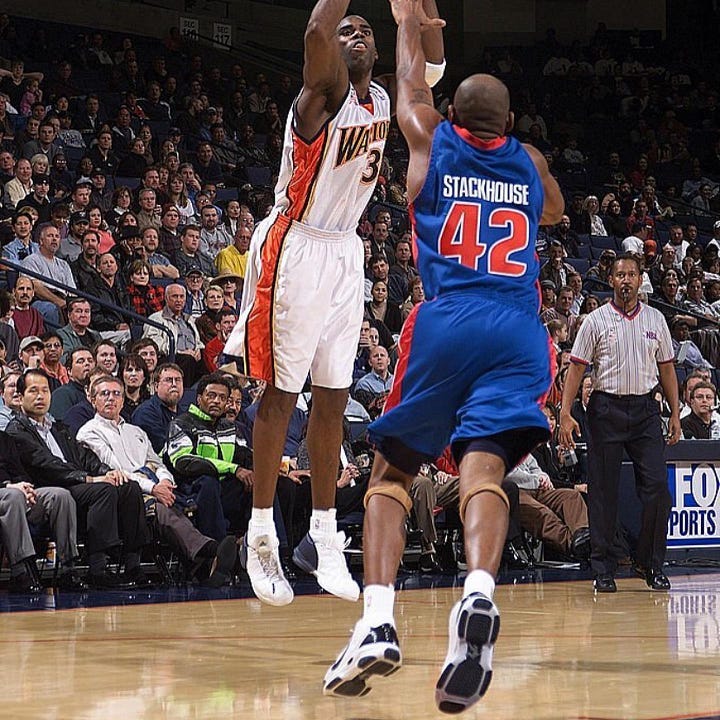 Jerry Stackhouse wearing the AND1 Silky Smooth with a Nike Swoosh drawn on.