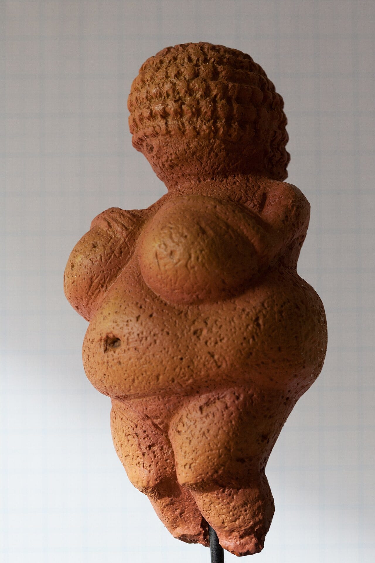 Small carved Ice Age figure of a full bodied woman Small carved Ice Age figure of a full bodied woman