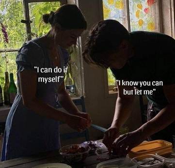 This may contain: two women are preparing food in the kitchen together and one woman is holding a knife