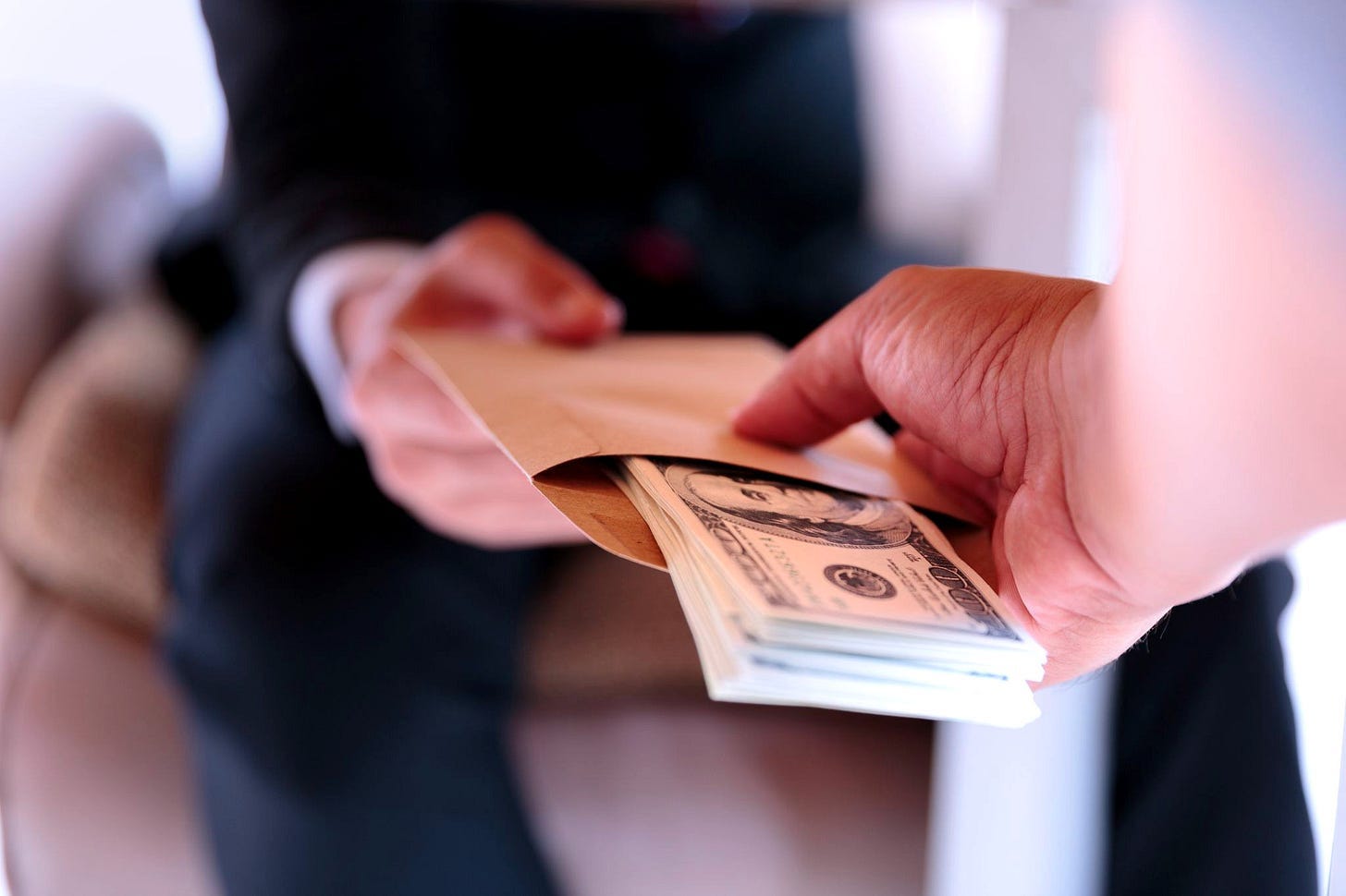 If council members become solely reliant on their city salary and benefits, their financial security becomes directly tied to re-election. Research suggests that this dynamic could make them more beholden to special interests and campaign donors. (Image source: Oakland Report / Adobe Stock)