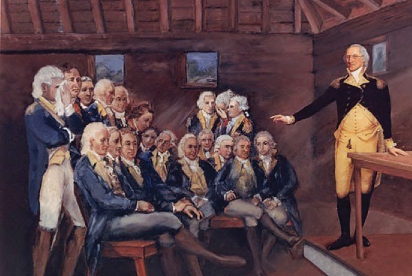 A painting shows George Washington’s surprise address to his men at Newburgh. Washington is standing at a table in the front of a room, while his men are standing or sitting while listening to him. A painting shows George Washington’s surprise address to his men at Newburgh. Washington is standing at a table in the front of a room, while his men are standing or sitting while listening to him.