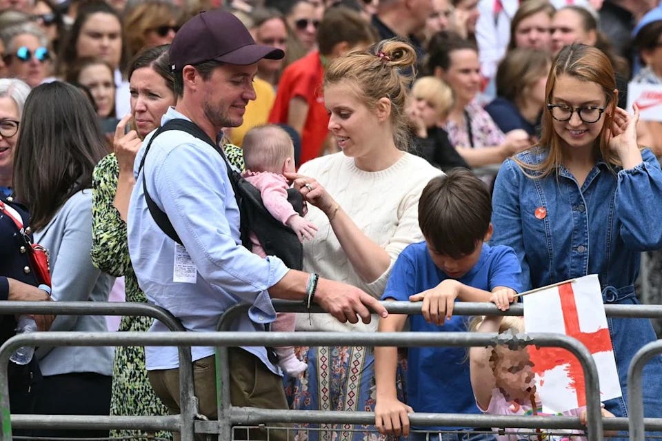 Beatrice and Edoardo with their children in the crowd at Lionesses parade