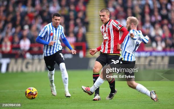Alfie Gilchrist of Sheffield United is challenged by Barry Bannan of...  News Photo - Getty Images
