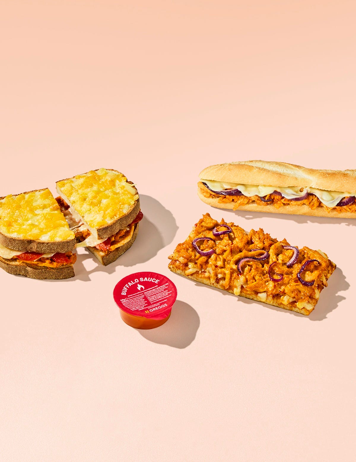 Chicken & Pepperoni Pizza Toastie, Buffalo Chicken Baguette and Buffalo Chicken Pizza on a pink background Chicken & Pepperoni Pizza Toastie, Buffalo Chicken Baguette and Buffalo Chicken Pizza on a pink background