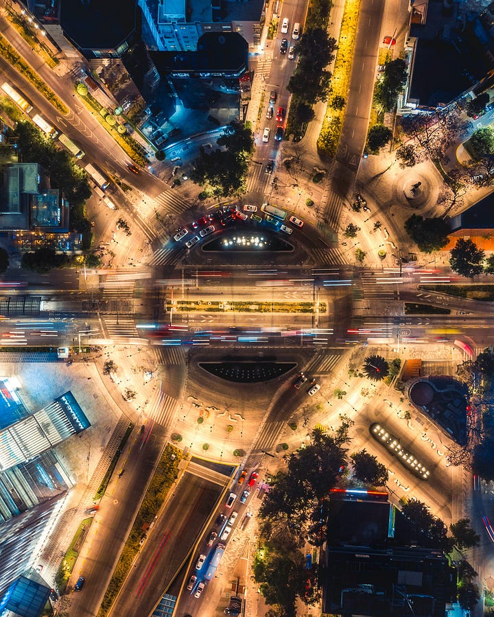 Overhead view of where two of the largest streets of Mexico City meet (photo by Oscar Reygo Unsplash). A bottle of agave spirits we enjoyed.