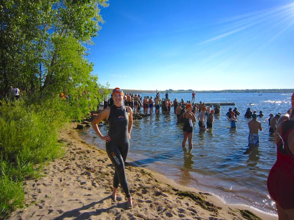 woman getting ready to start the swim in a triathlon woman getting ready to start the swim in a triathlon