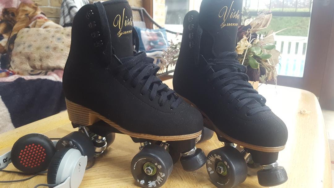 black roller skates on table black roller skates on table