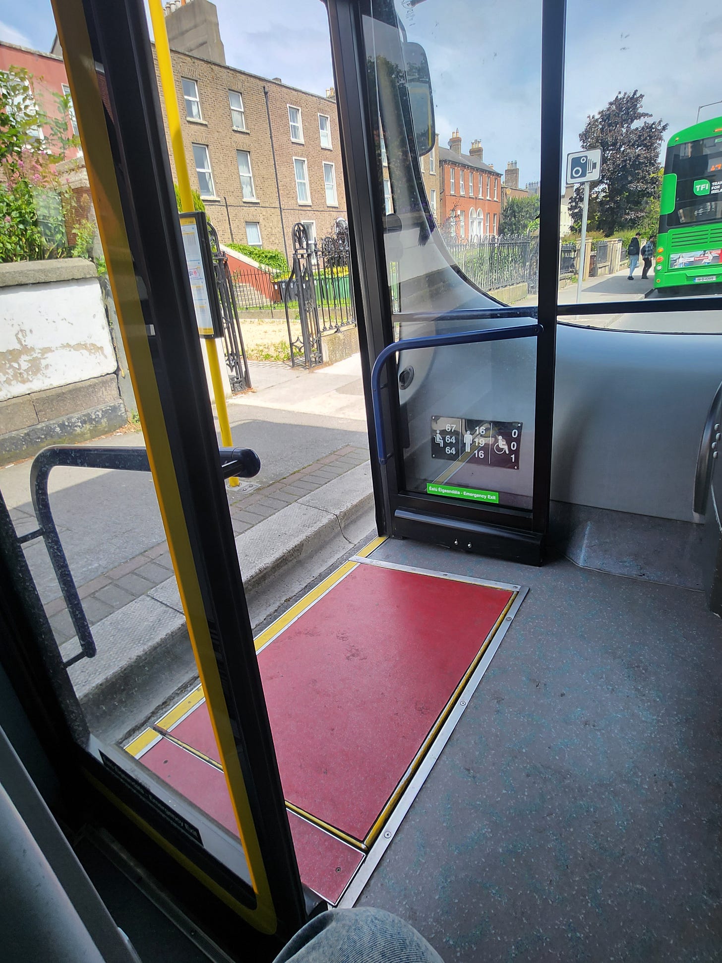 Taken from the inside of the bus, this photo shows the gap between the bus and the footpath. The ramp will not open, making it impossible for a wheelchair user to get off. 