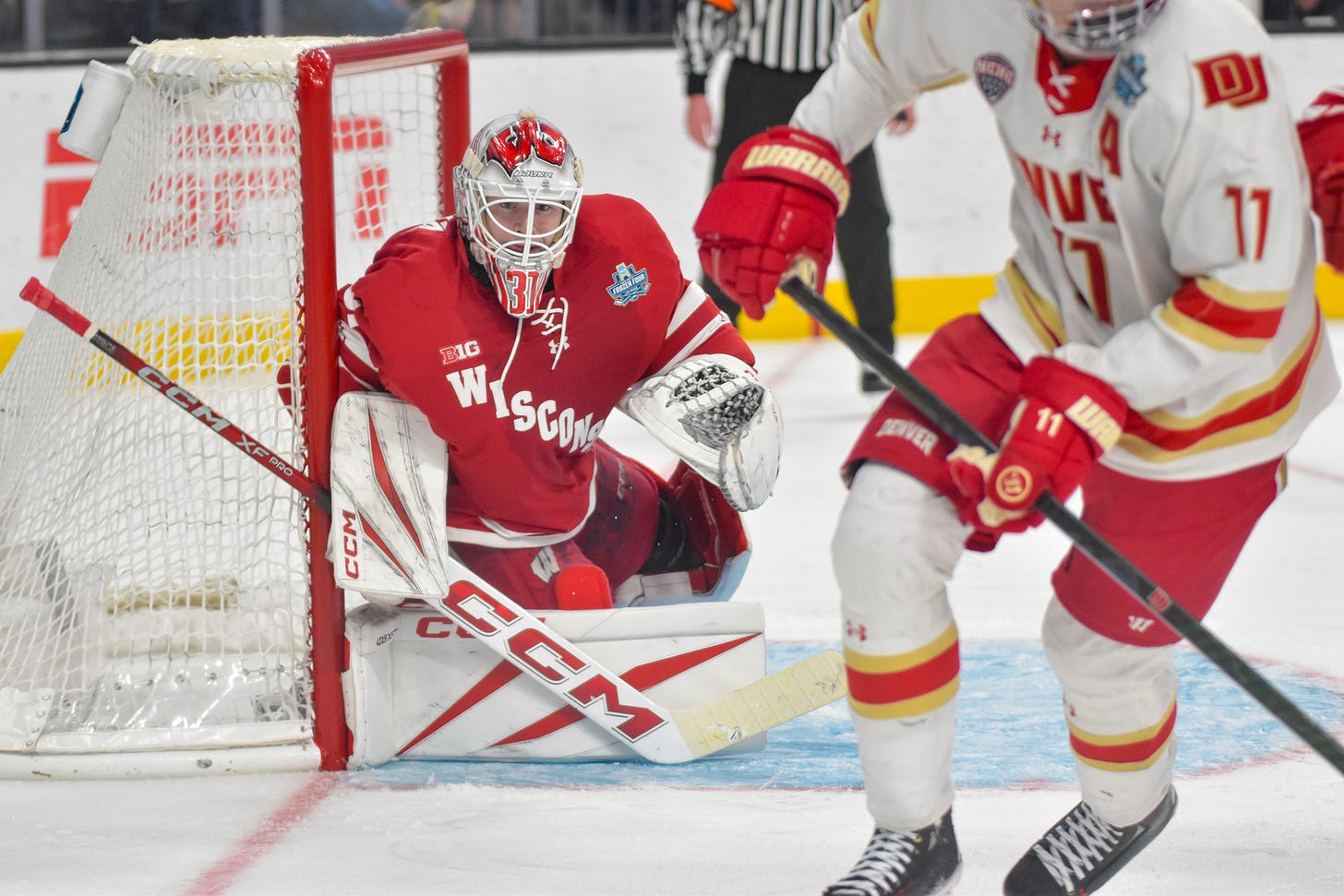 Goaltender Daniel Hauser with right blocker pad down against goal pipe looking into corner during 2026 NCAA Mens Frozen Four.