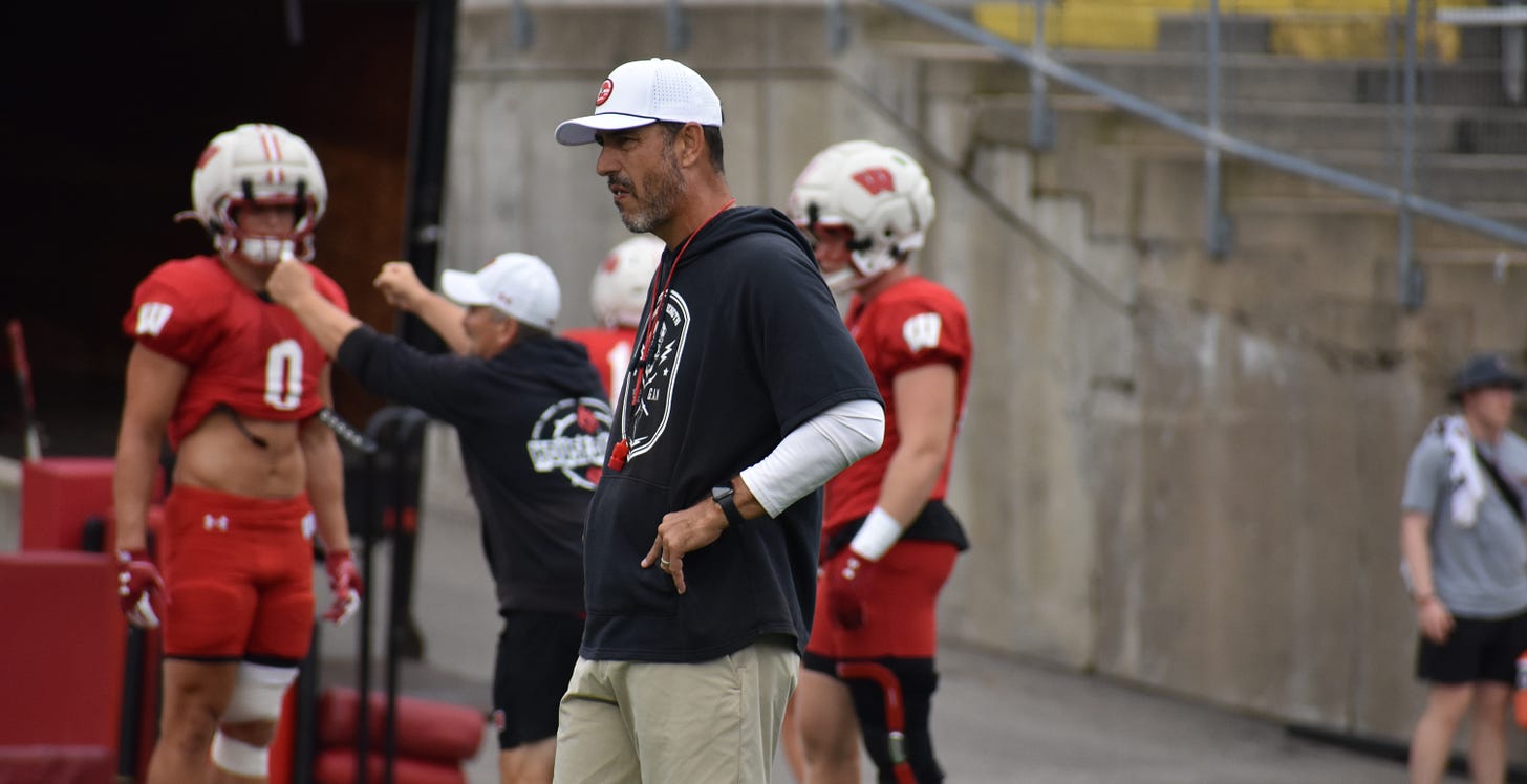 Luke Fickell watches from the field during Wisconsin Badgers fall camp practice at Camp Randall Stadium. Luke Fickell watches from the field during Wisconsin Badgers fall camp practice at Camp Randall Stadium.