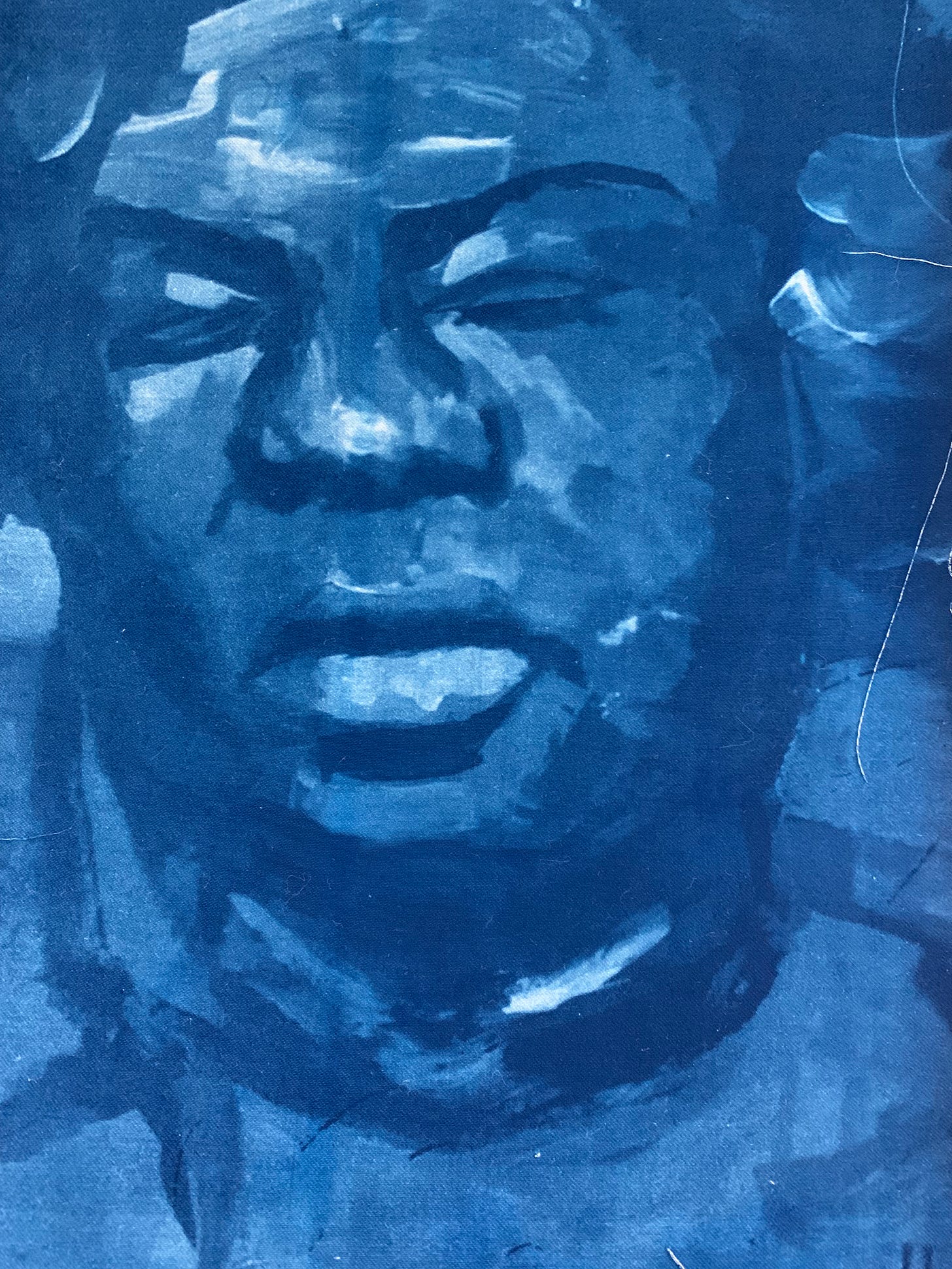 A cyanotype of a face A cyanotype of a face