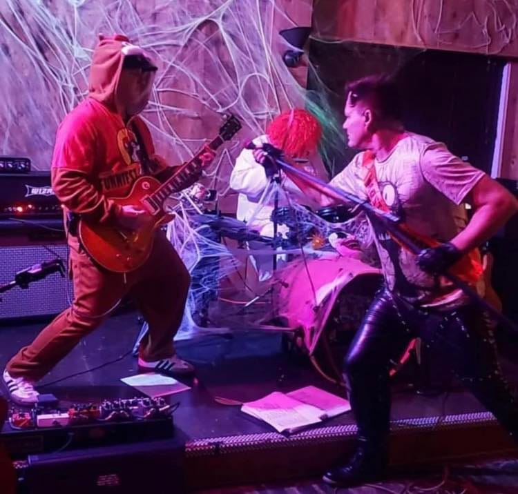 May be an image of 2 people and guitar