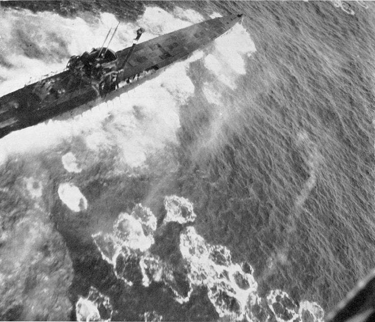Close-up of U-1229, a 740-ton U-boat under attack by aircraft from USS ...