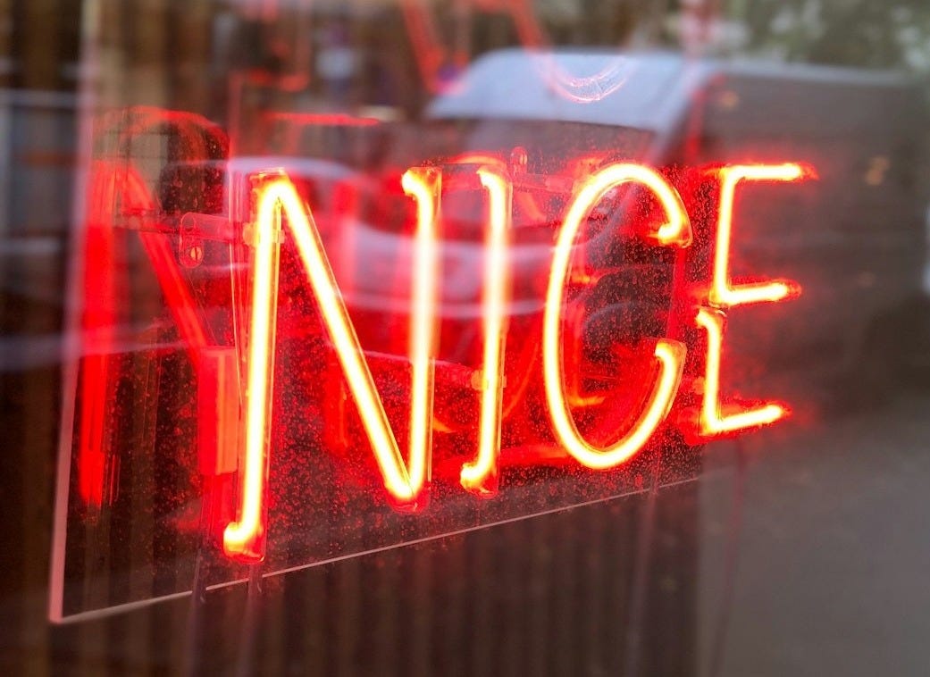 shallow focus photo of red nice neon light signage
