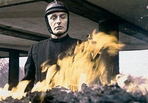 A fireman burns books in this movie still from Fahrenheit 451