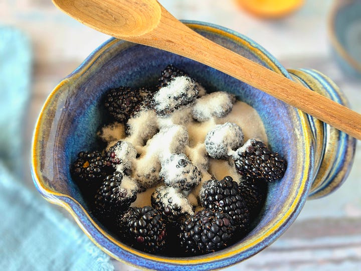 steps for making the blackberry coulis by combining, muddling, and straining blackberries, sugar, and salt