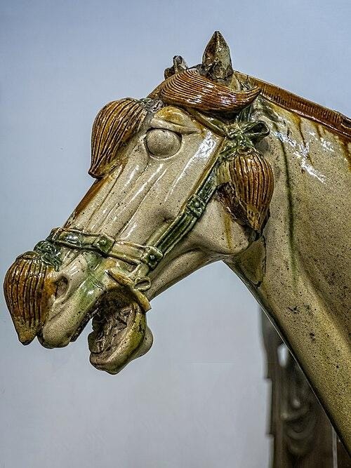 A statue of a horse
Description automatically generated