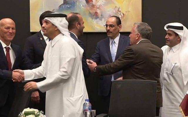 Israeli negotiator Nitzan Alon (far left) shakes hands with Qatar's Prime Minister Mohammed bin Abdulrahman bin Jassim Al Thani in a photo indicating success in the mediated Israel-Hamas negotiations on a Gaza hostage-ceasefire agreement in Sharm el-Sheikh, in the early hours of October 9, 2025. Second from right with back to camera is US special Middle East envoy Steve Witkoff. (Telegram / used in accordance with clause 27a of the copyright law)