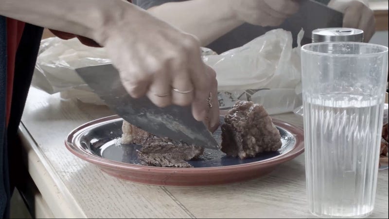 Cutting meat on a plate
