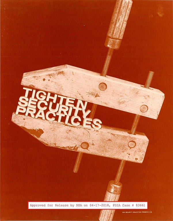 A wooden clamp is tightened on the words "tighten security practices" on a red background. A declassification marking reads "Approved for Release by NAS on 04-17-2018, FOICA Case # 83661" A wooden clamp is tightened on the words "tighten security practices" on a red background. A declassification marking reads "Approved for Release by NAS on 04-17-2018, FOICA Case # 83661"