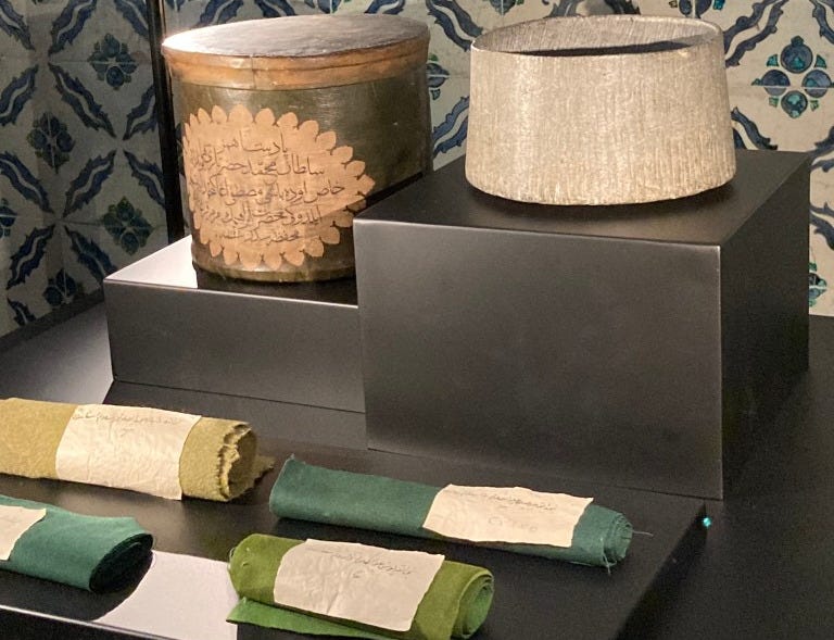 Stone pot attributed to Abraham along with drapes belonging to various prophets.