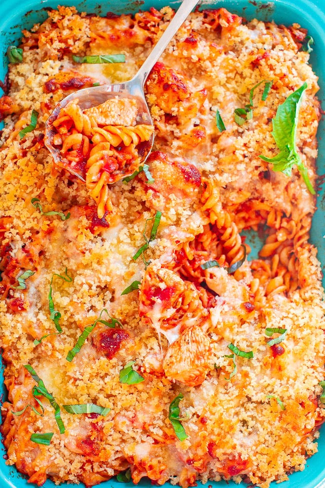 Chicken Parmesan Pasta Casserole with a spoon on top. Chicken Parmesan Pasta Casserole with a spoon on top.