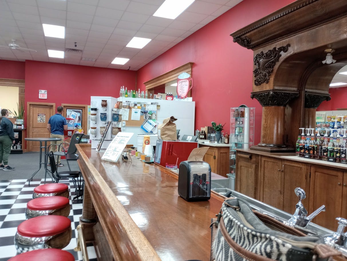 Interior of drugstore, with large wooden bar 