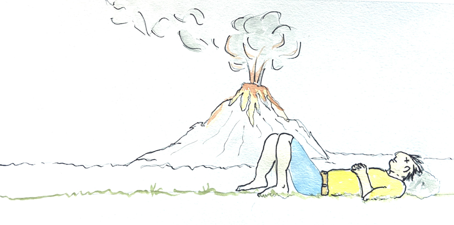 man napping next to a volcano